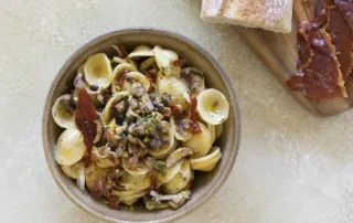 the kitchen doesnt bite pasta with jamon serrano mushrooms truffled cheese and citrus