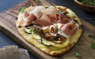 the kitchen doesnt bite r Ricotta Flatbread with Zucchini, Caramelized Onions, Lemon & ConsorcioSerrano Ham