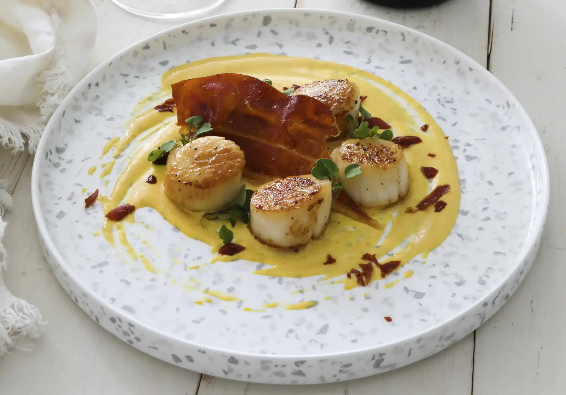 Scallops With Ají Amarillo Sauce and Consorcioserrano Ham